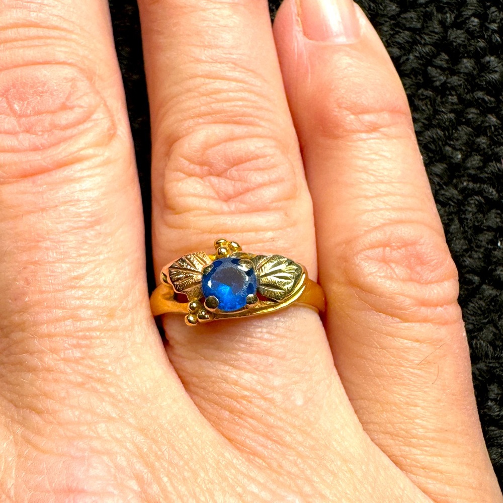 Black Hills Gold ring, sometimes called tri-colored gold with synthetic stone.